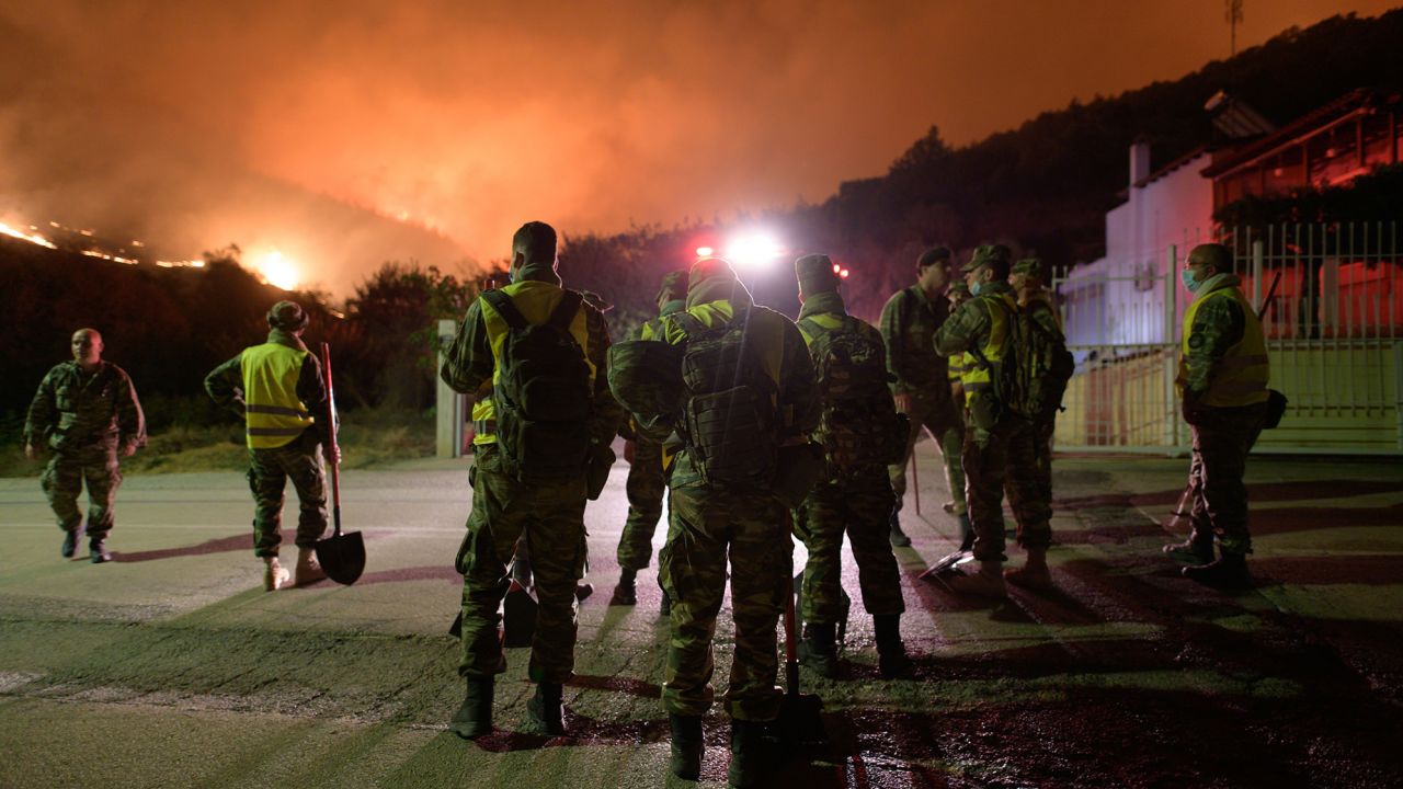 Firefighters battle a wildfire in Loutra Alexandroupolis, Thrace, northern Greece, on August 19, 2023. 
