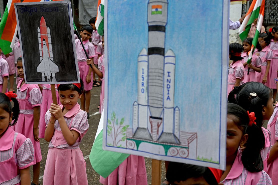 Students hold posters as they gather in support of the Chandrayaan-3 spacecraft in Mumbai on August 22, 2023. The Indian Space Research Organisation (ISRO) confirmed that the lander module of the Chandrayaan-3, which means "Mooncraft" in Sanskrit, had "successfully separated" from the propulsion module six days ahead of a planned landing slated for August 23. India launched a rocket on July 14 carrying an unmanned spacecraft to land on the Moon, its second attempt to do so as its cut-price space programme seeks to reach new heights. (Photo by INDRANIL MUKHERJEE / AFP) (Photo by INDRANIL MUKHERJEE/AFP via Getty Images)