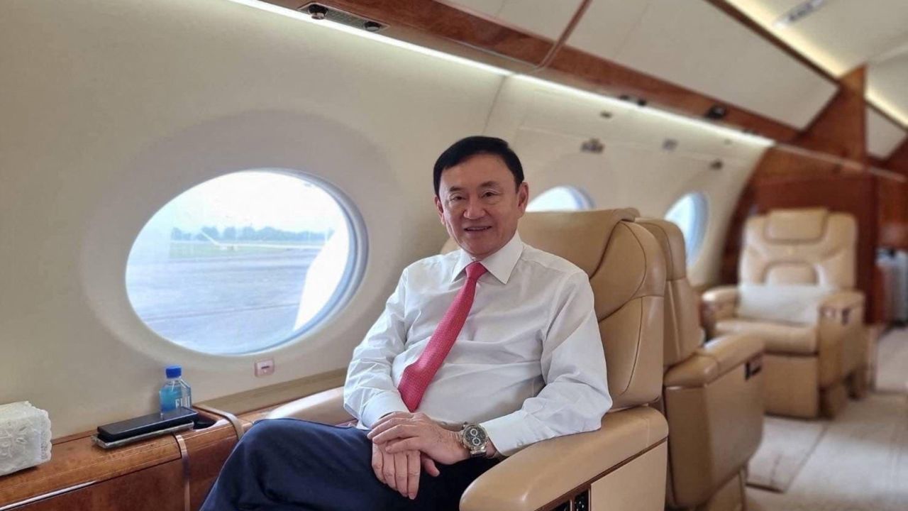 Former Thai Prime Minister Thaksin Shinawatra as he ends almost two decades of self-imposed exile, pictured inside a plane at an unknown location in this image released on August 22.