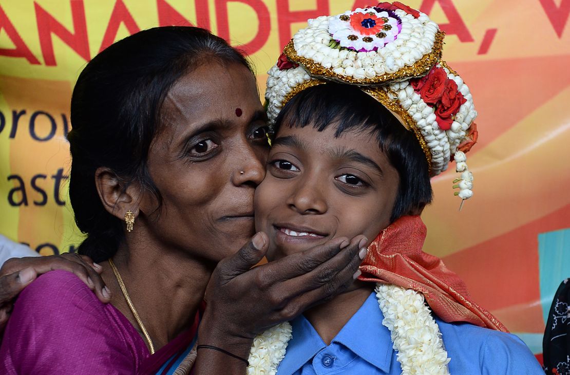 Indian chess prodigy Rameshbabu Praggnanandhaa, then 12, smiles with his mother Nagalakshmi in Chennai on June 26, 2018. 