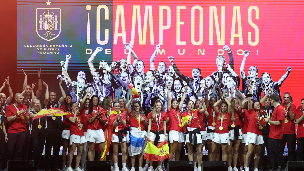 Olga Carmona stands at the front of the squad during the celebrations.