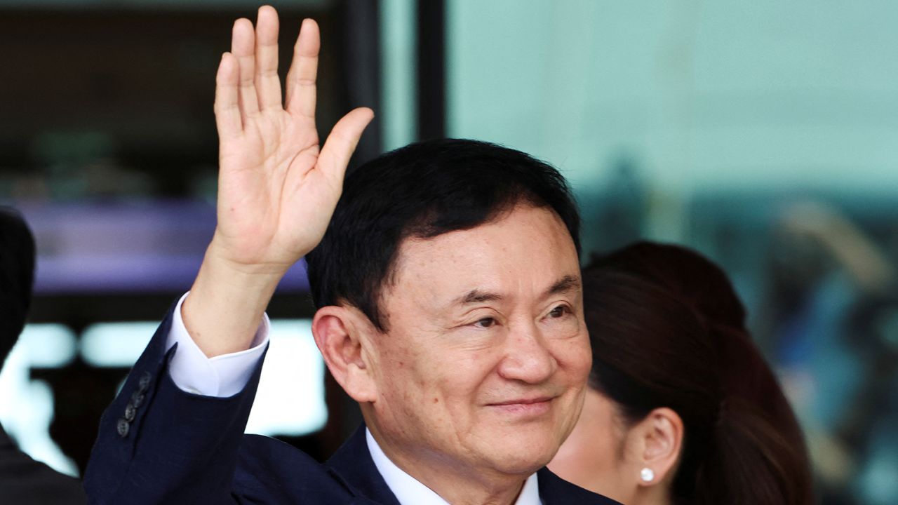 Former Thai Prime Minister Thaksin Shinawatra, who is expected to be arrested upon his return as he ends almost two decades of self-imposed exile, waves at Don Mueang airport in Bangkok, Thailand August 22, 2023.