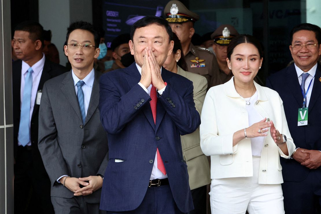 Former Thai Prime Minister Thaksin Shinawatra while flanked by his son Panthongtae Shinawatra and daughter Paetongtarn Shinawatra at Don Mueang airport in Bangkok, Thailand on August 22.