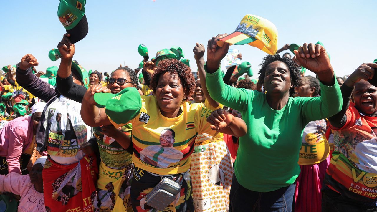 Supporters of Zimbabwe's President Emmerson Mnangagwa cheer at a rally ahead of the 2023 general elections on August 23, 2023.
