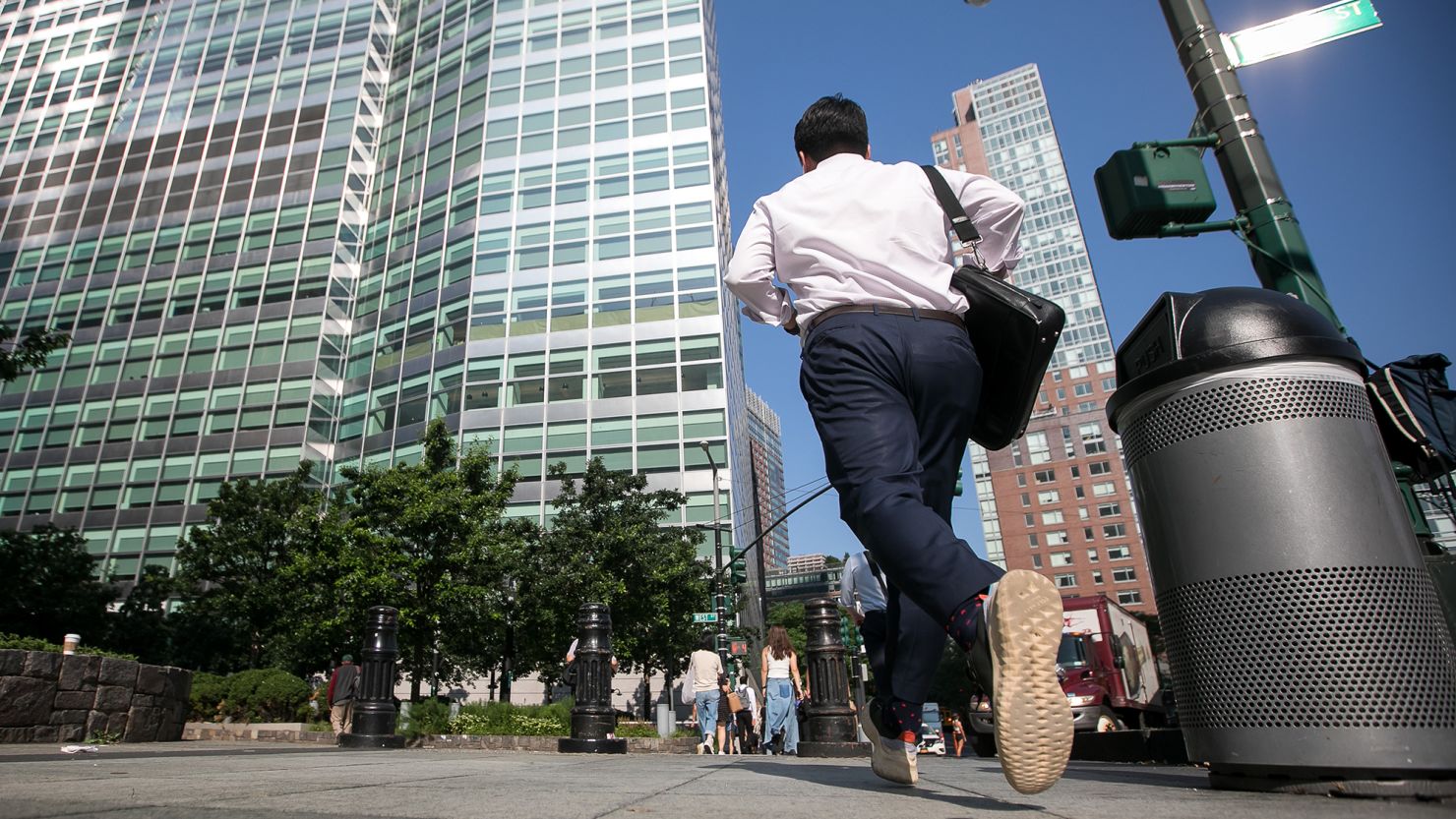 Pedestrians walk towards Goldman Sachs headquarters in New York, US, on Thursday, July 6, 2023.