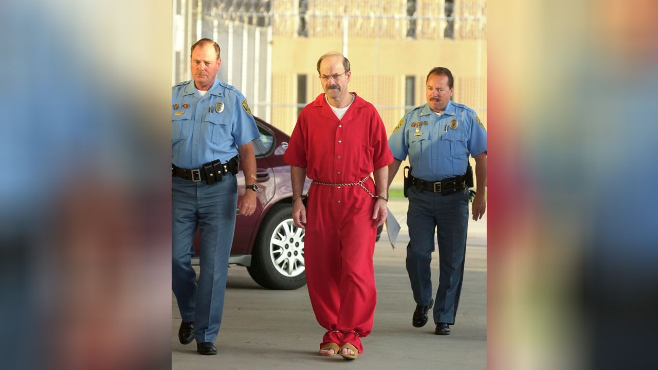 Convicted serial killer Dennis Rader, known as the BTK strangler walks into the El Dorado Correctional Facility with two Sedgwick County sheriff's officers on Friday, Aug. 19, 2005 in El Dorado, Kansas. 