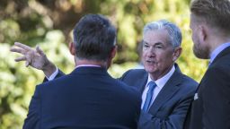 Federal Reserve Chair Jerome Powell, center, talks with attendees of the central bank's annual symposium at Jackson Lake Lodge in Grand Teton National Park, Aug. 26, 2022. in Moran, Wyo. 