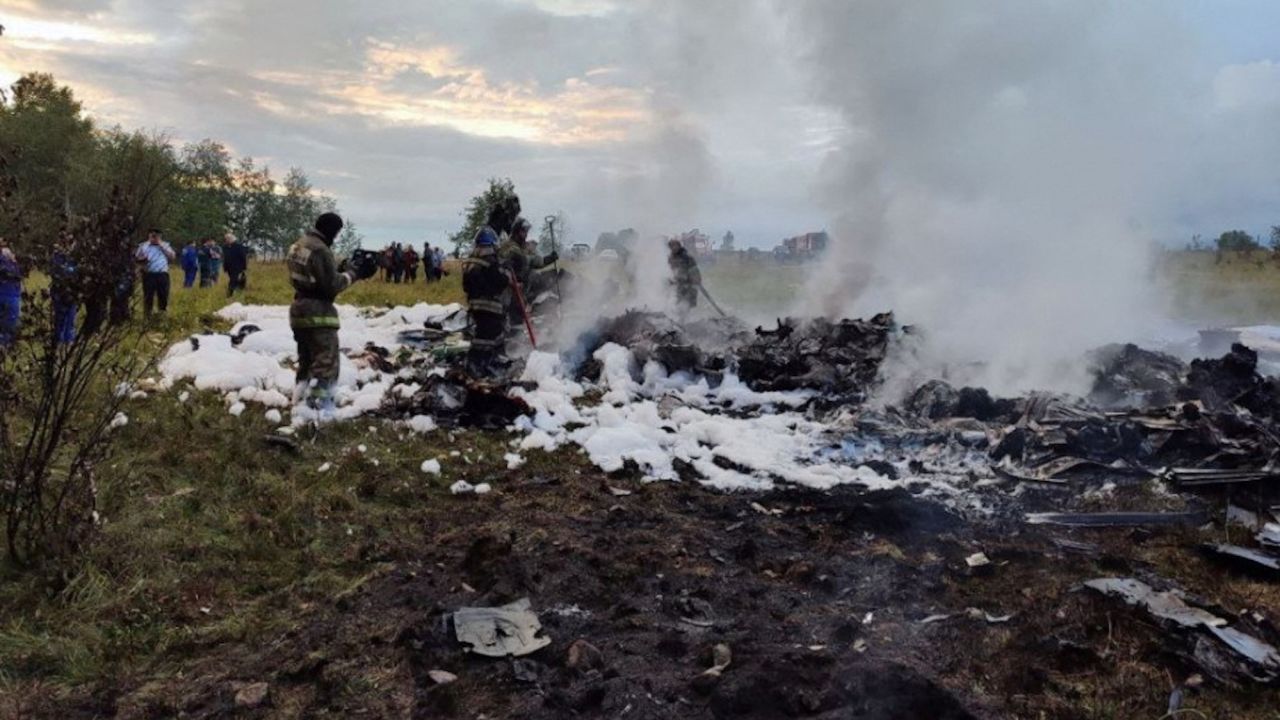 Firefighters work amid the wreckage on August 23 following the crash of Prigozhin's private jet.