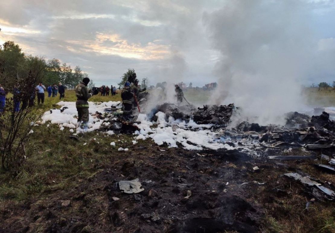 Firefighters work amid the wreckage on August 23 following the crash of Prigozhin's private jet.