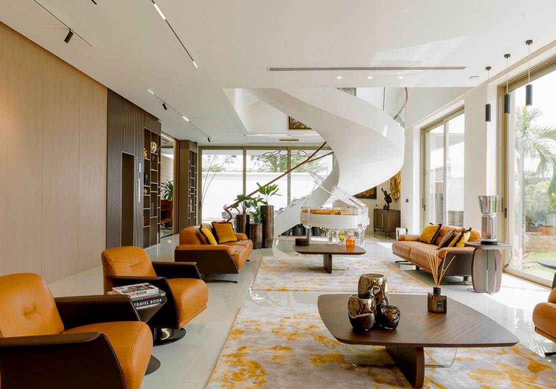 The Lantern House is cmDesign Atelier's first private residential project on the island. The five-bedroom, seven-bathroom, three-story sustainable home is powered entirely by solar energy. The interior, designed by the client (who runs an interior design firm in Lagos, <a href="https://www.cmdesign-atelier.com/portfolios/lantern-house/" target="_blank" target="_blank">according to the architecture firm</a>), contrasts the minimal style with bold colors and patterns.