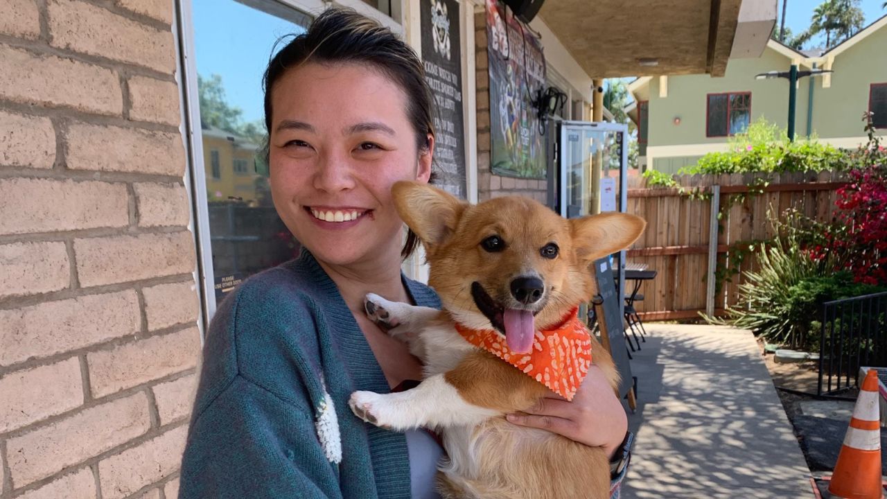 Luer Yin and her dog, Zeni.