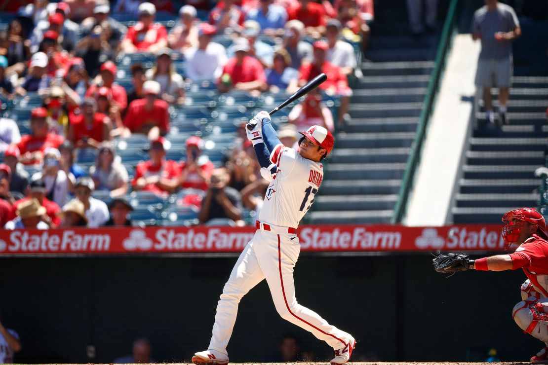 ANAHEIM, CALIFORNIA - AUGUST 23: Shohei Ohtani #17 of the Los Angeles Angels hits a two-run home run against the Cincinnati Reds in the first inning during game one of a doubleheader at Angel Stadium of Anaheim on August 23, 2023 in Anaheim, California. (Photo by Ronald Martinez/Getty Images)