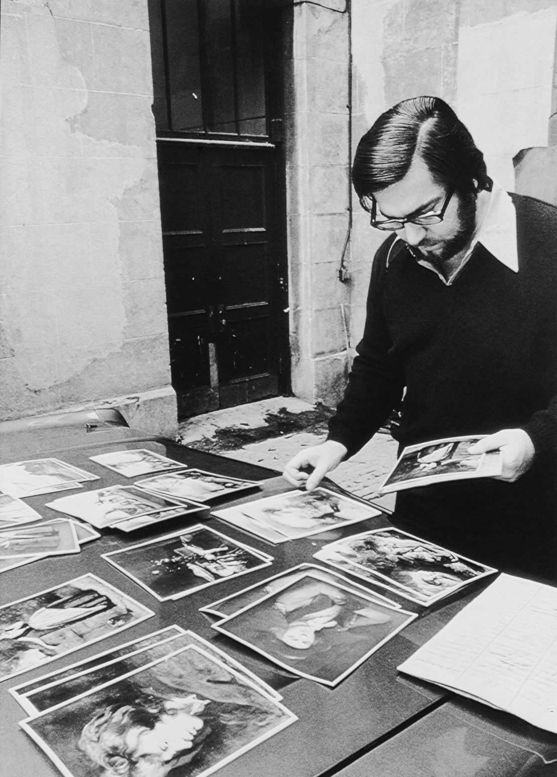 Bill Bantey, the Montreal Museum of Fine Arts' director of public relations,  is seen showing photos of the 18 paintings stolen in 1972.