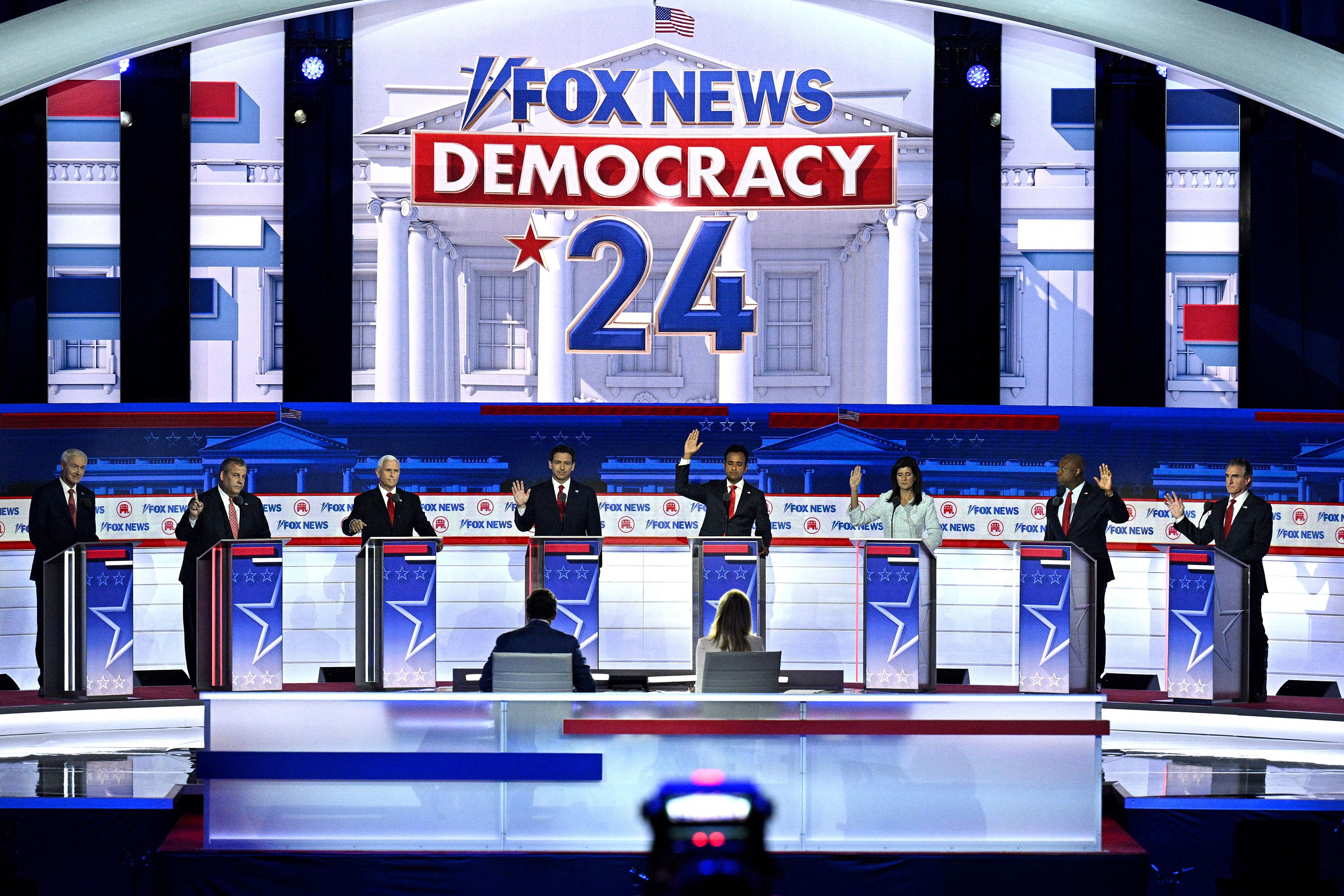 Republican presidential candidates raise their hands during a debate in Milwaukee on Wednesday, August 23. This was after they were asked whether they would support former President Donald Trump if he was the GOP nominee and he was convicted in a court of law. Only former Arkansas Gov. Asa Hutchinson did not raise his hand.