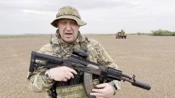 Yevgeny Prigozhin, chief of Russian private mercenary group Wagner, gives an address in camouflage and with a weapon in his hands in a desert area at an unknown location, in this still image taken from video possibly shot in Africa and published August 21, 2023. Courtesy PMC Wagner via Telegram via REUTERS ATTENTION EDITORS - THIS IMAGE WAS PROVIDED BY A THIRD PARTY. NO RESALES. NO ARCHIVES. MANDATORY CREDIT.     TPX IMAGES OF THE DAY     