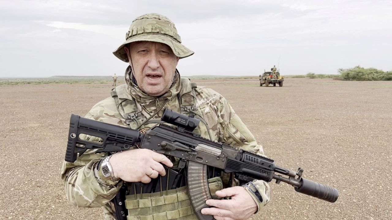 Yevgeny Prigozhin gives an address in camouflage and with a weapon in his hands in a desert area at an unknown location, in this still image taken from video possibly shot in Africa and published August 21, 2023.