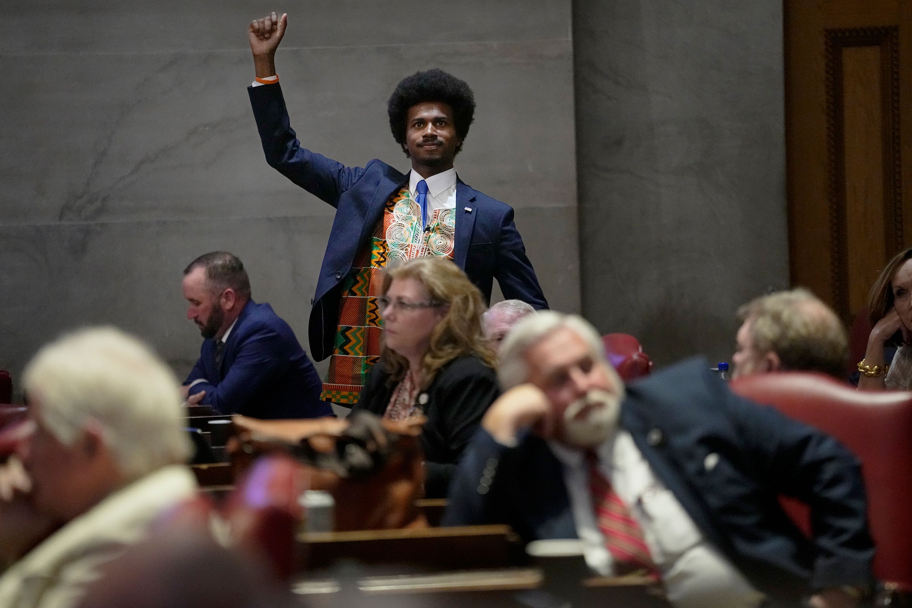 Tennessee Rep. Justin Pearson raises his fist, acknowledging people in the gallery during a special session of the state legislature in Nashville on Monday, August 21. The session focused on public safety and mental health in the wake of a deadly school shooting that took place in March.