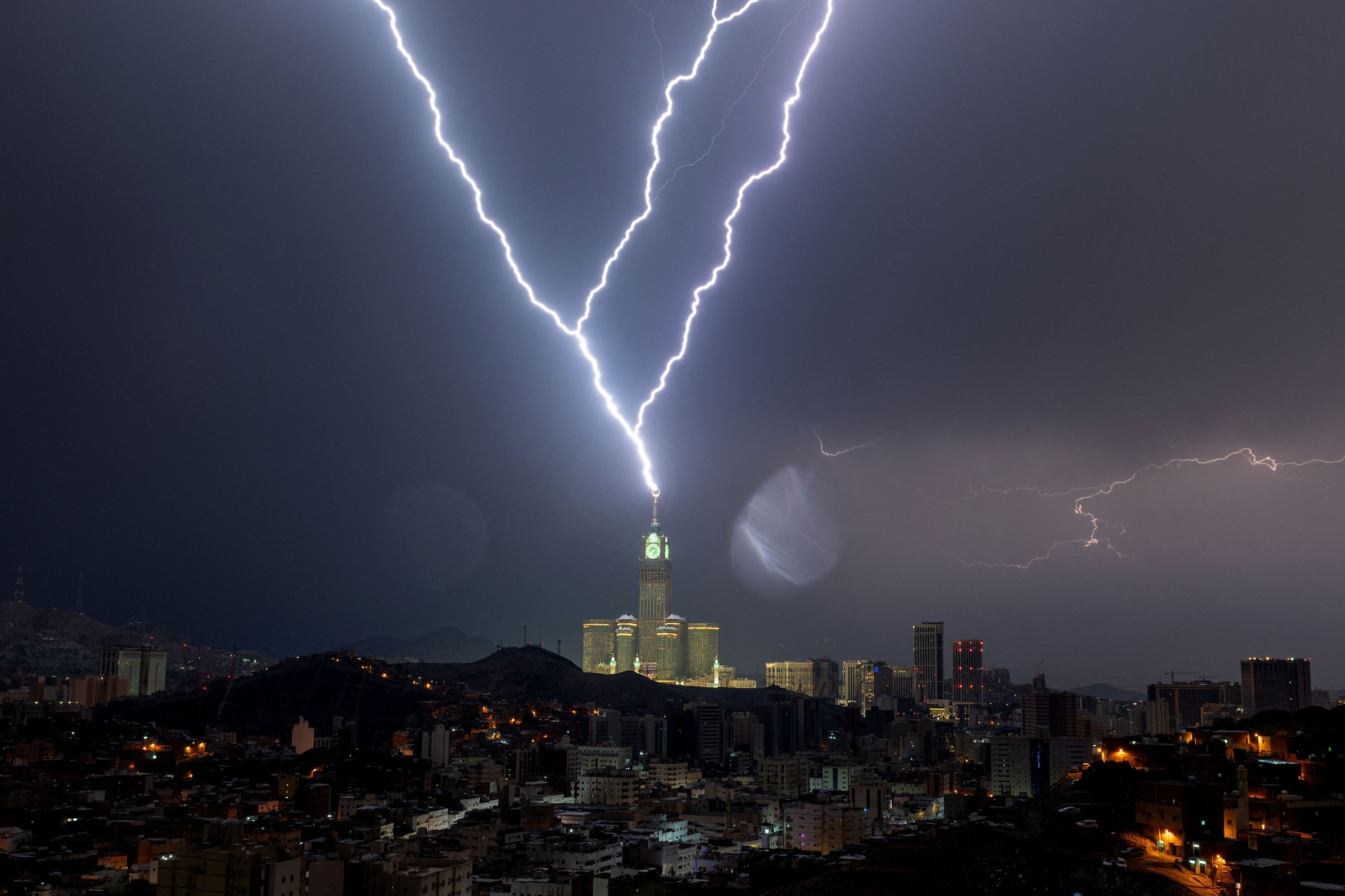 Lightning strikes a clock tower in Mecca, Saudi Arabia, on Tuesday, August 22.