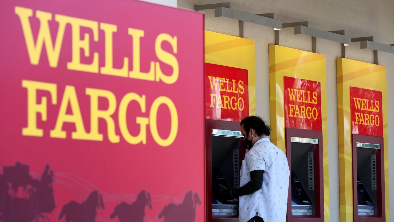 Wells Fargo customers use the ATM at a bank branch on August 08, 2023 in San Bruno, California.