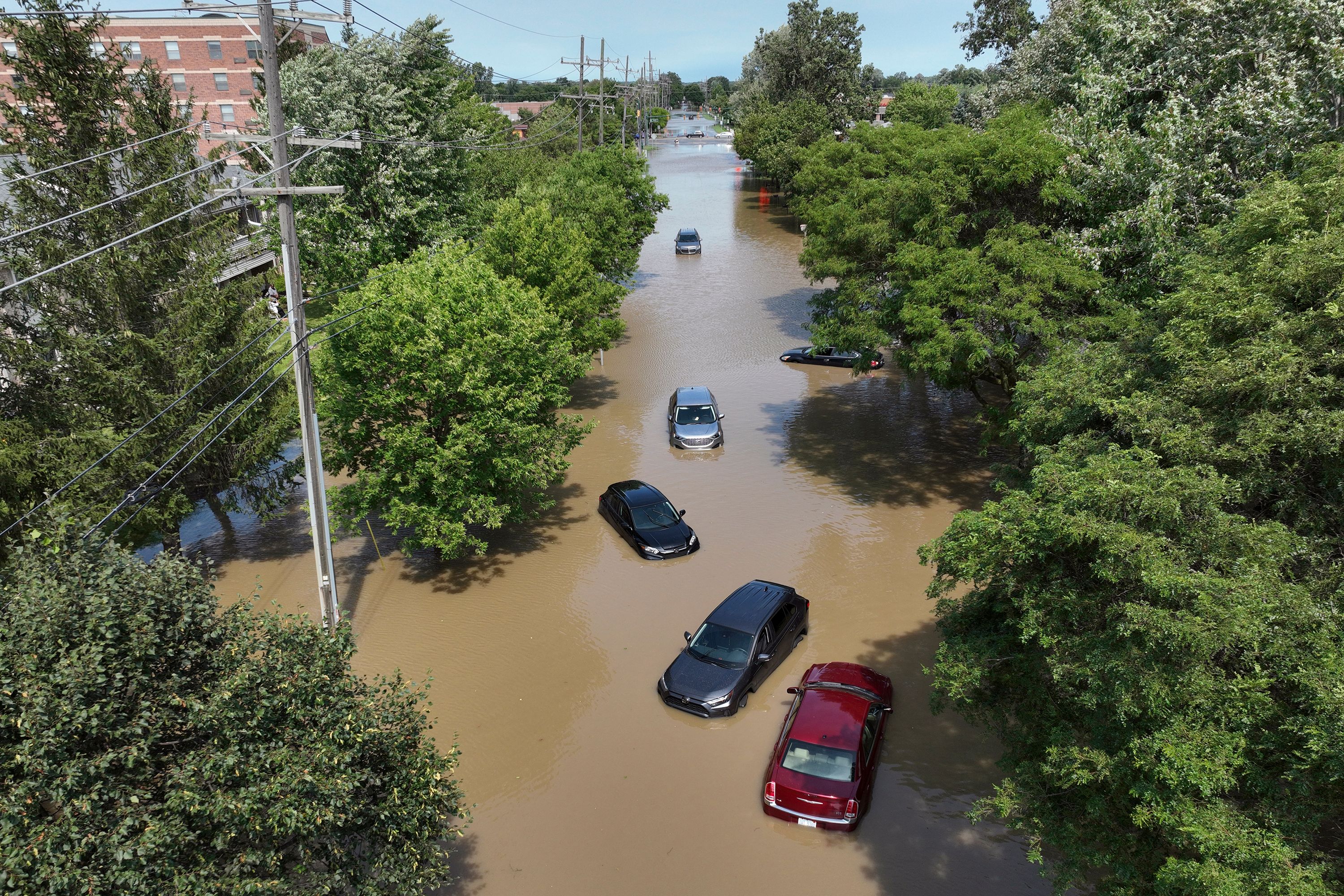 Cars are stranded in floodwaters in Canton, Michigan, on Thursday, August 24. Heavy rainfall led to street flooding in the Detroit area.