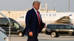 Former President Donald Trump steps off his plane as he arrives at Hartsfield-Jackson Atlanta International Airport, Thursday, Aug. 24, 2023, in Atlanta. (AP Photo/Alex Brandon)