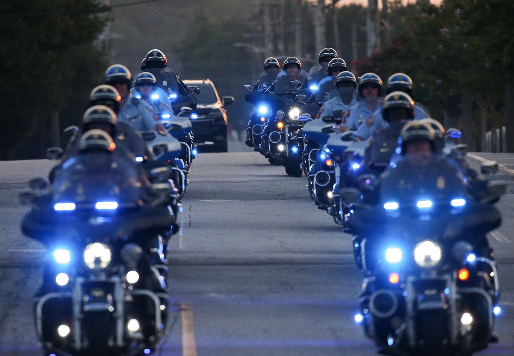 A motorcade carrying former US President Donald Trump leaves the Fulton County jail on Thursday, August 24.