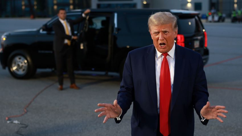 ATLANTA, GEORGIA - AUGUST 24: Former U.S. President Donald Trump speaks to the media at Atlanta Hartsfield-Jackson International Airport after surrendering at the Fulton County jail on August 24, 2023 in Atlanta, Georgia. Trump was booked on multiple charges related to an alleged plan to overturn the results of the 2020 presidential election in Georgia. (Photo by Joe Raedle/Getty Images)