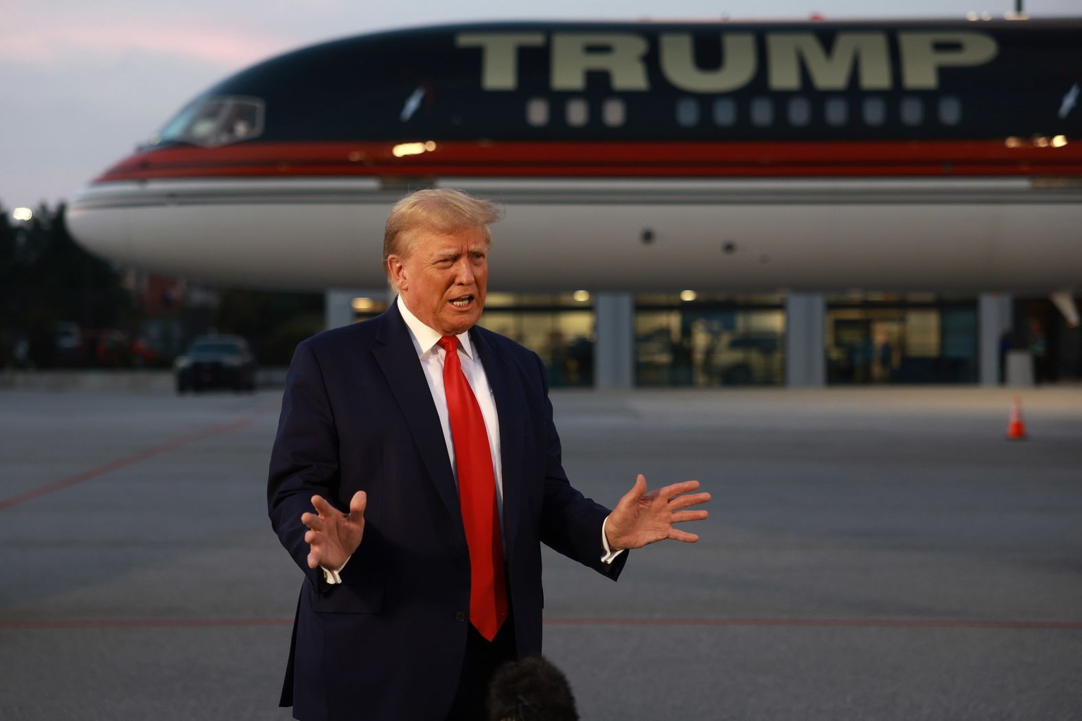 Trump speaks to the media at Hartsfield-Jackson Atlanta International Airport after surrendering at the Fulton County jail on Thursday. "I did nothing wrong," <a href="index.php?page=&url=https%3A%2F%2Fwww.cnn.com%2Fpolitics%2Flive-news%2Ftrump-georgia-surrender-indictment-08-24-23%2Fh_f0d3690dac70a28a64248287ac1b8a21" target="_blank">Trump told reporters</a> before boarding his plane.