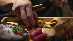 A chef prepares a Sashimi platter at FUMI Japanese restaurant in Hong Kong on August 24.