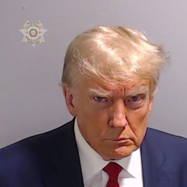 This <a href="https://www.cnn.com/2023/08/24/politics/trump-mug-shot-analysis/index.html" target="_blank">booking photo</a> of Trump was taken in Atlanta in August 2023. Trump was booked on more than a dozen charges stemming from his efforts to reverse Georgia's 2020 election results. His booking number was P01135809. He is the first former US president with a mug shot.