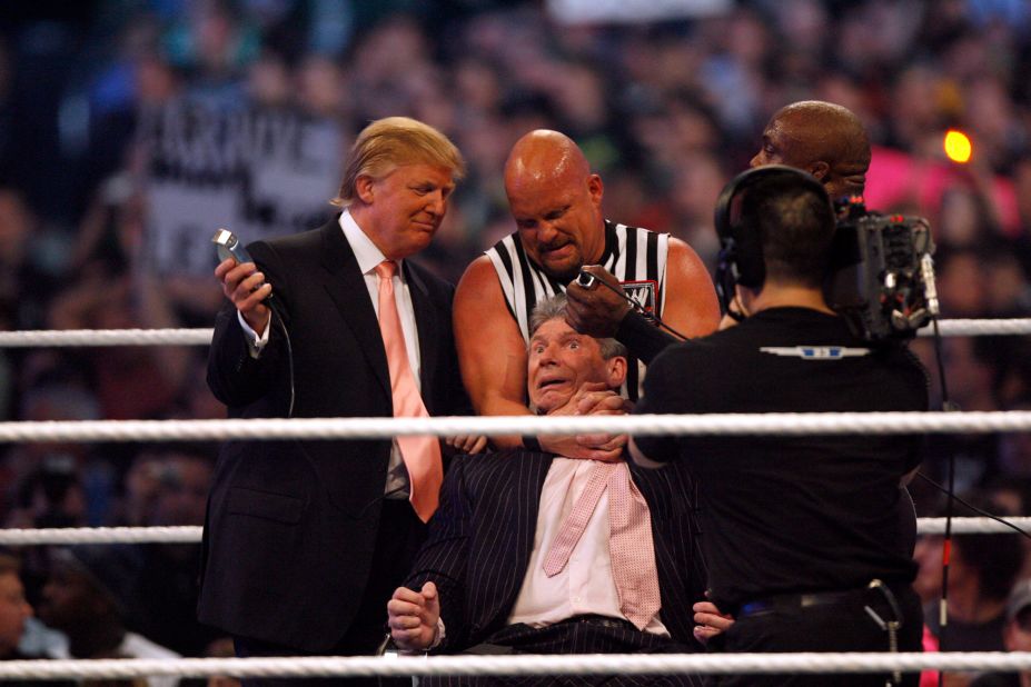 Trump and WWE wrestlers Stone Cold Steve Austin and Bobby Lashley get ready to shave Vince McMahon's head after McMahon lost the main event of the night — "Hair vs. Hair" — between McMahon and Trump in 2007. Trump has close ties with the WWE and McMahon, its CEO. After being elected president, Trump picked McMahon's wife, Linda, to serve as the administrator of the Small Business Administration.