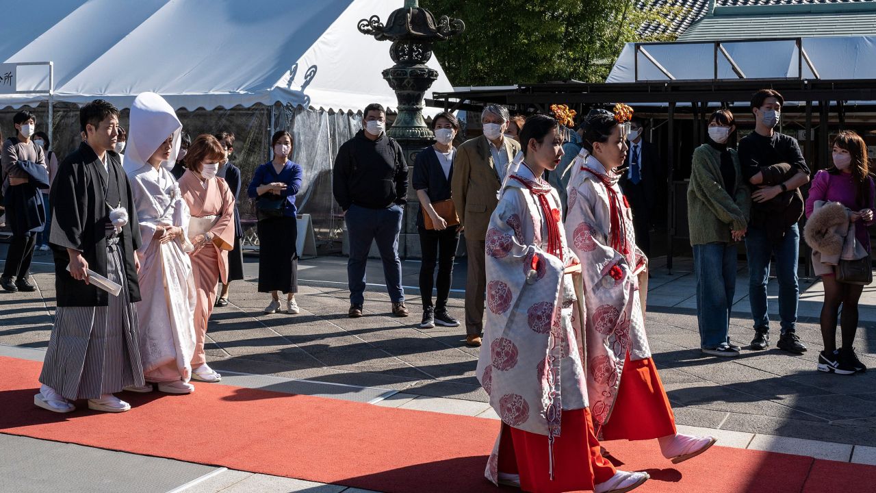 A bride and groom take part in a wedding ceremony at Hie Shrine in central Tokyo on November 3, 2022.