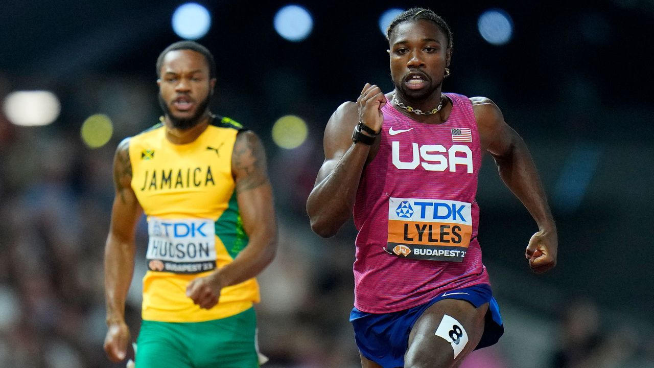 Noah Lyles of the United States moves past Andrew Hudson of Jamaica in the men's 200 meters semifinal during the World Athletics Championships in Budapest, Hungary, Thursday, Aug. 24, 2023.  (AP Photo/Peter David Josek)
