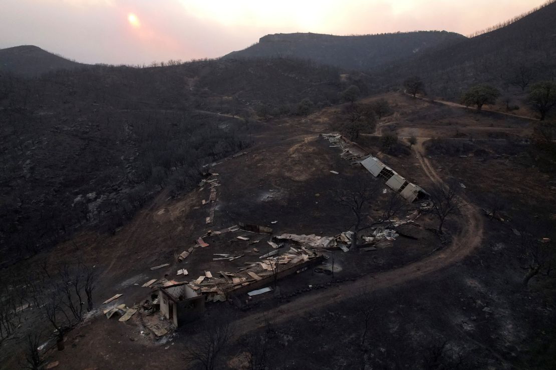 Destroyed corral where eighteen bodies were found following a wildfire near the village of Avantas.