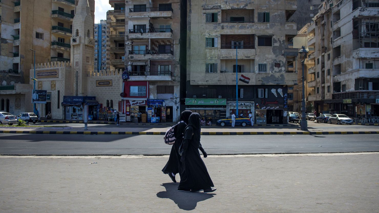 Two women walk by the corniche in Alexandria, Egypt, in September 2017.