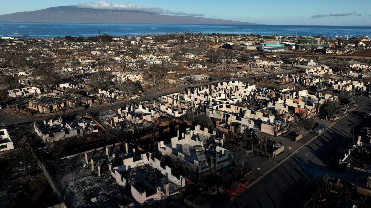 In an aerial view, burned cars and homes are seen in a neighborhood that was destroyed by a wildfire on August 18, 2023 in Lahaina, Hawaii.