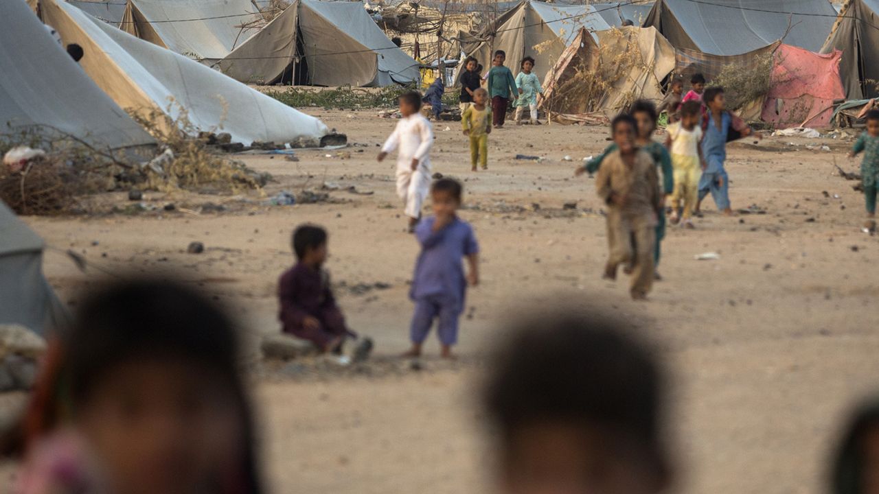 Children play at a refugee camp for people displaced by monsoon floods, in the Karachi Division of Sindh province, Pakistan, on Sunday, May 21, 2023. 