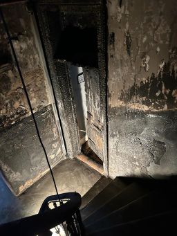 Fire damage is shown at the Glasgow tenement block where Carina Haouchine used to live.