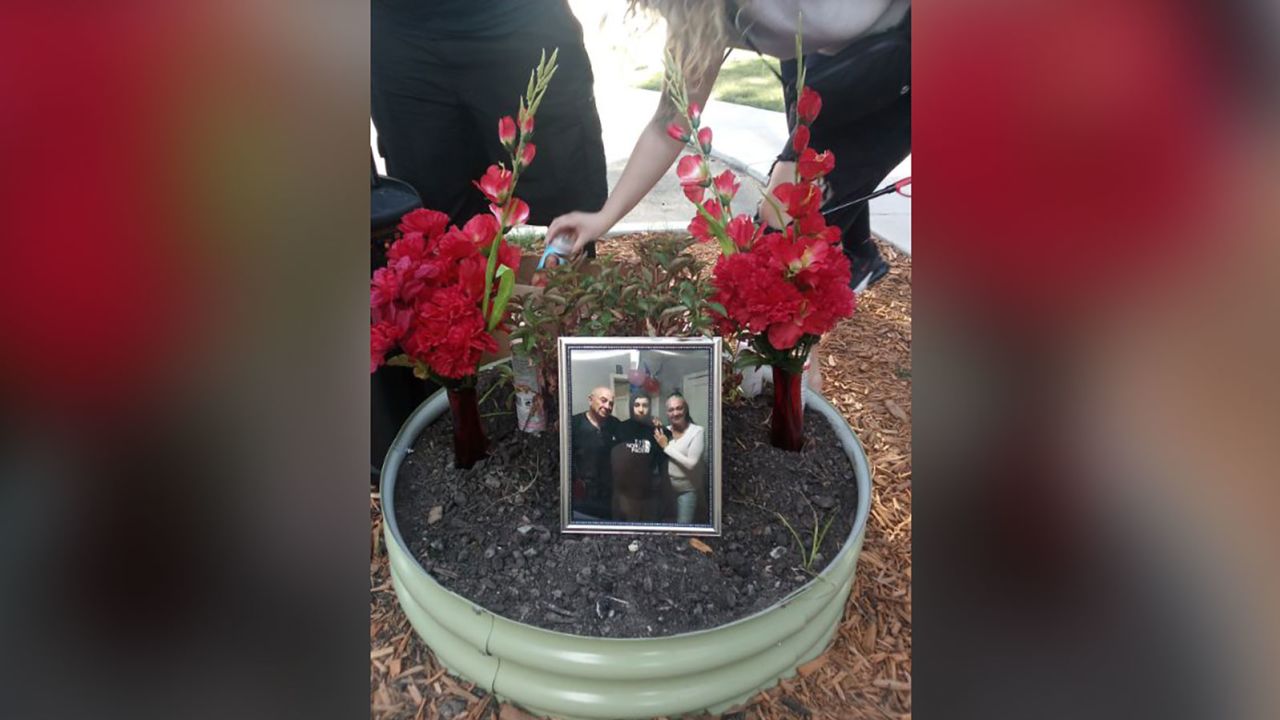 A memorial sits on the stoop where Raul Rios used to hang out, listening to music and playing with the neighborhood children.