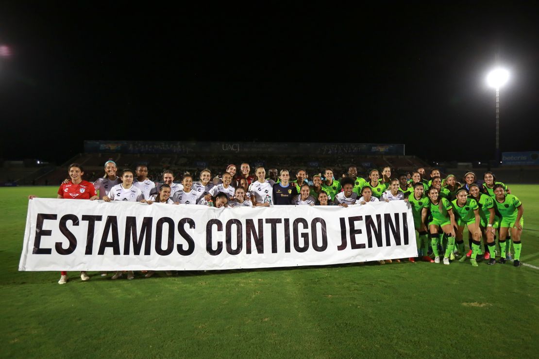 Players of the Pachuca women's club hold up a banner with a message that reads in Spanish: "We are with you Jenni," in reference to their team member Jenni Hermoso, before the start of a match in Ciudad Juarez, Mexico, on Friday.