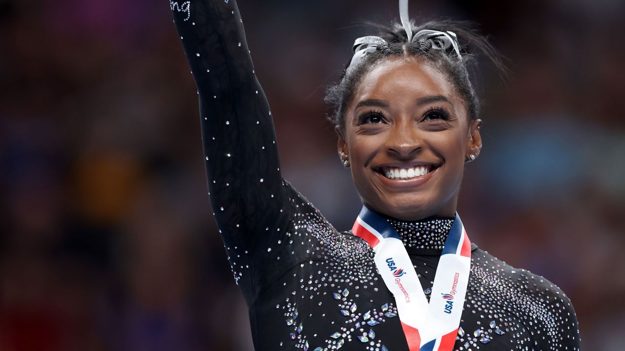 SAN JOSE, CALIFORNIA - AUGUST 27: Simone Biles celebrates after placing first in the balance beam competition on day four of the 2023 U.S. Gymnastics Championships at SAP Center on August 27, 2023 in San Jose, California. (Photo by Ezra Shaw/Getty Images)