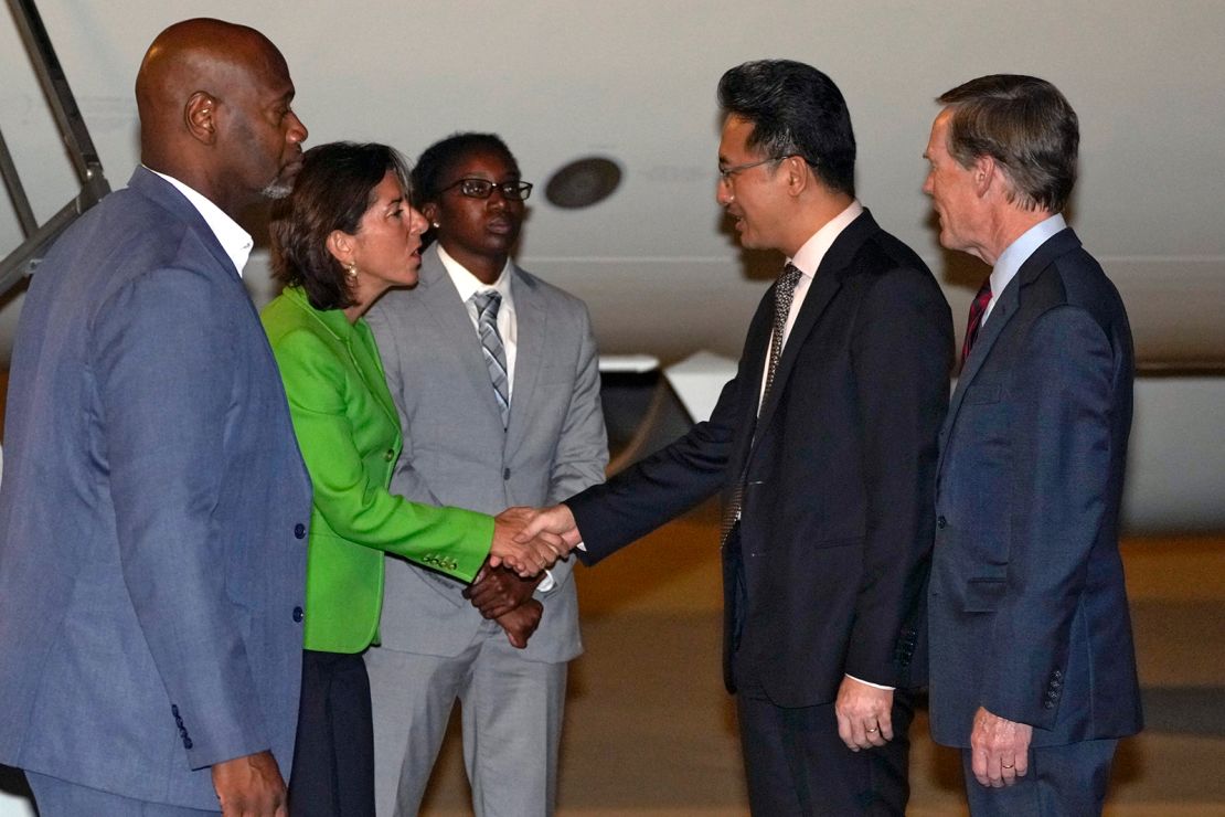 US Commerce Secretary Gina Raimondo shakes hands with Lin Feng, Director General of China's Ministry of Commerce, upon her arrival at the Beijing Capital International Airport on Sunday.