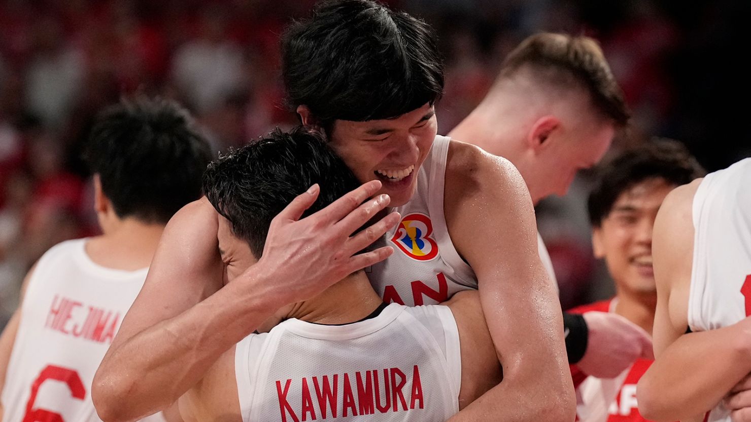Japan's Yuta Watanabe and Yuki Kawamura celebrate beating Finland in the basketball World Cup in Okinawa on  August 27, 2023. 