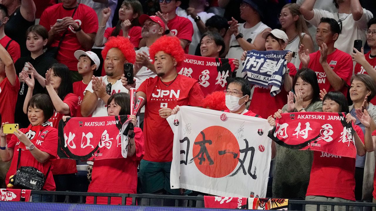 Japan's supporters celebrate after the team beat Finland in Okinawa on August 27, 2023. 