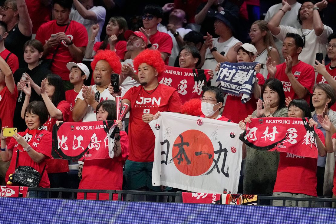 Japan's supporters celebrate after the team beat Finland in Okinawa on August 27, 2023. 