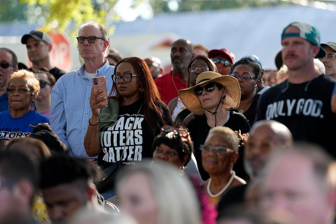 Residents of the Jacksonville community attend a prayer vigil for the victims Sunday.