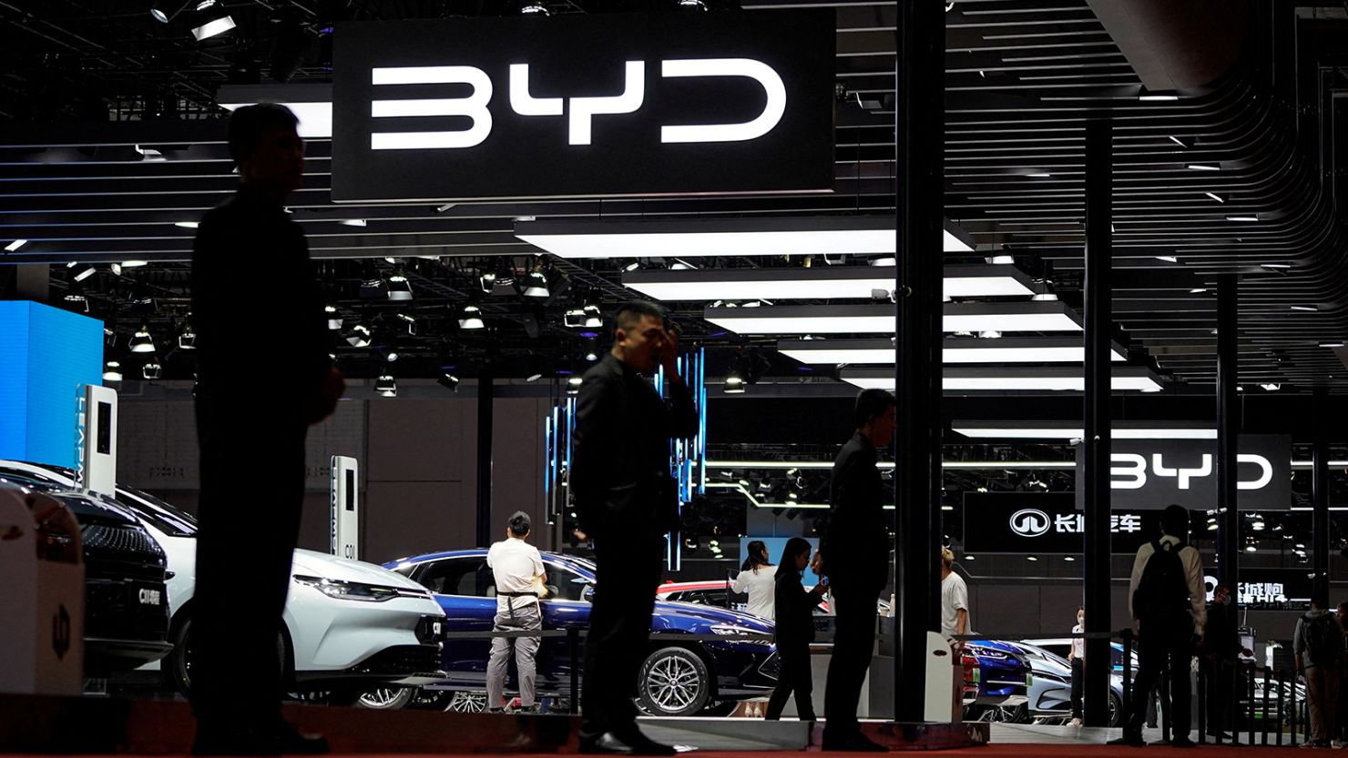 Security guards stand at the BYD booth at the Auto Shanghai show, in Shanghai, China April 19, 2023.