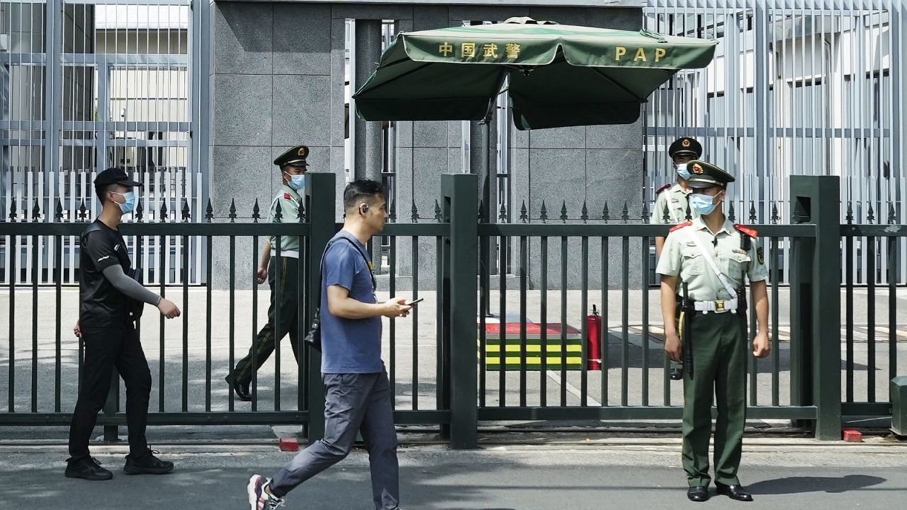 Security officers in front of the Japanese embassy in Beijing, China, on August 26, 2023.