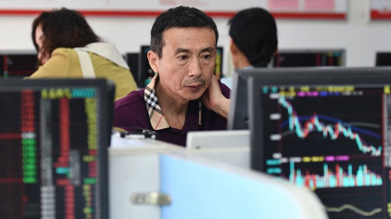 NextImg:Chinese stocks get brief uplift from first share dealing tax cut since 2008 | CNN Business