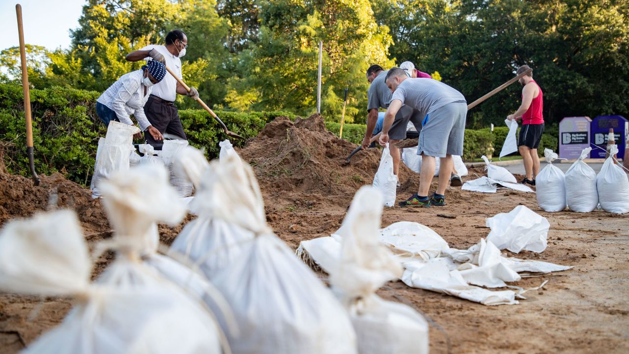 Tallahassee residents fill sandbags as they prepare for the storm.